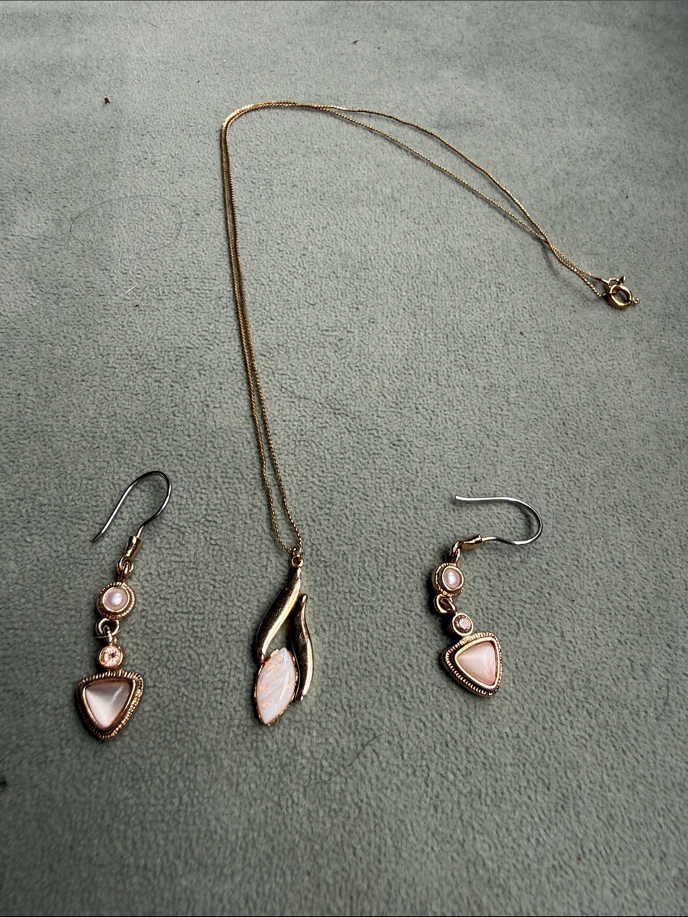 Gold coordinating earrings and necklaces